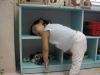 For this cute baby, the shelf is just as good as any pillow
